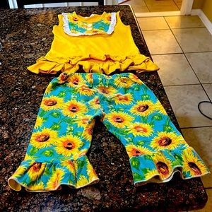 A two piece sunflower gold and green Capri set for a little girl size 5
